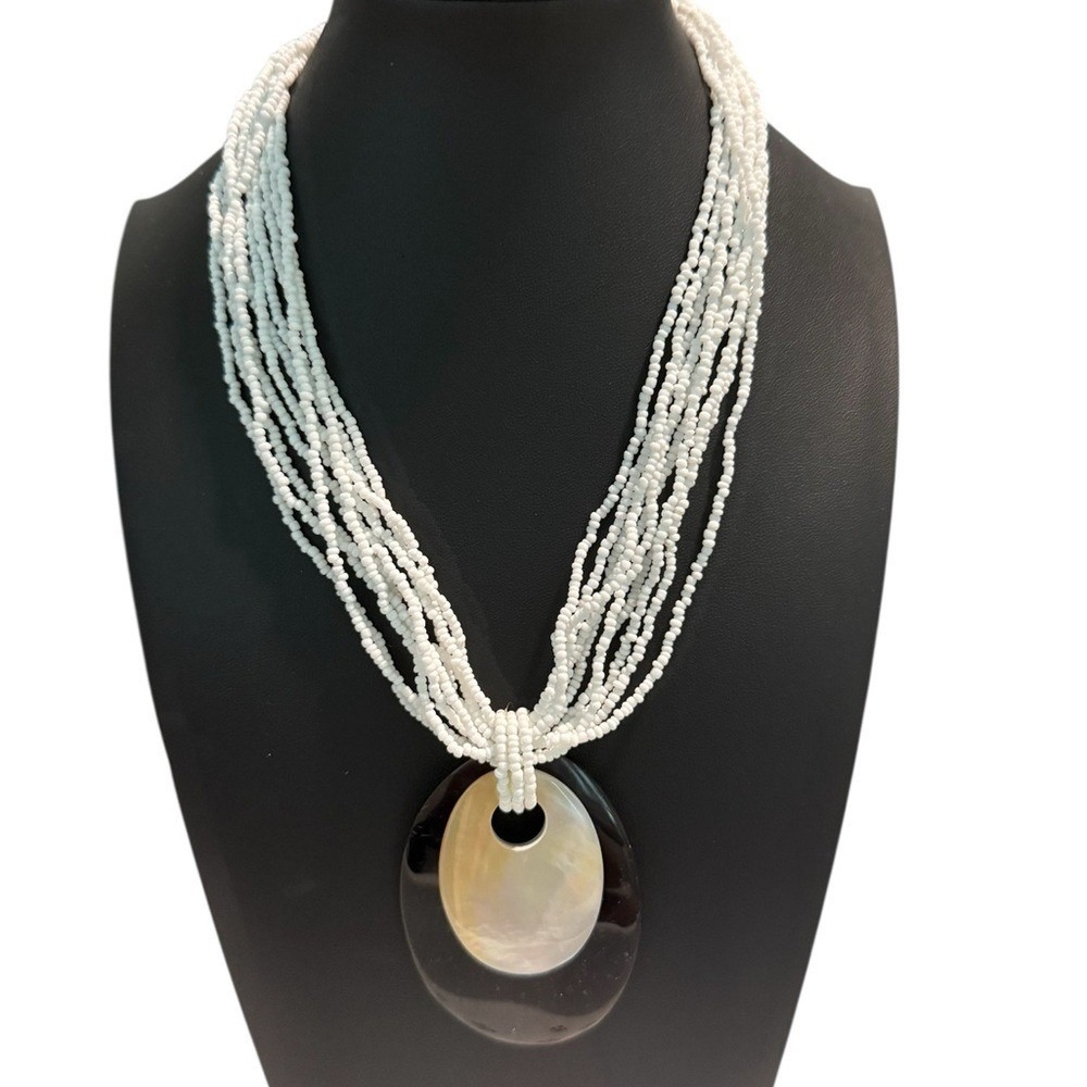 Multi-Strand White Necklace with Black‎ and Cream Pendant